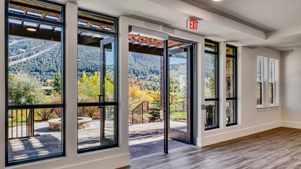 a room with windows and an open door